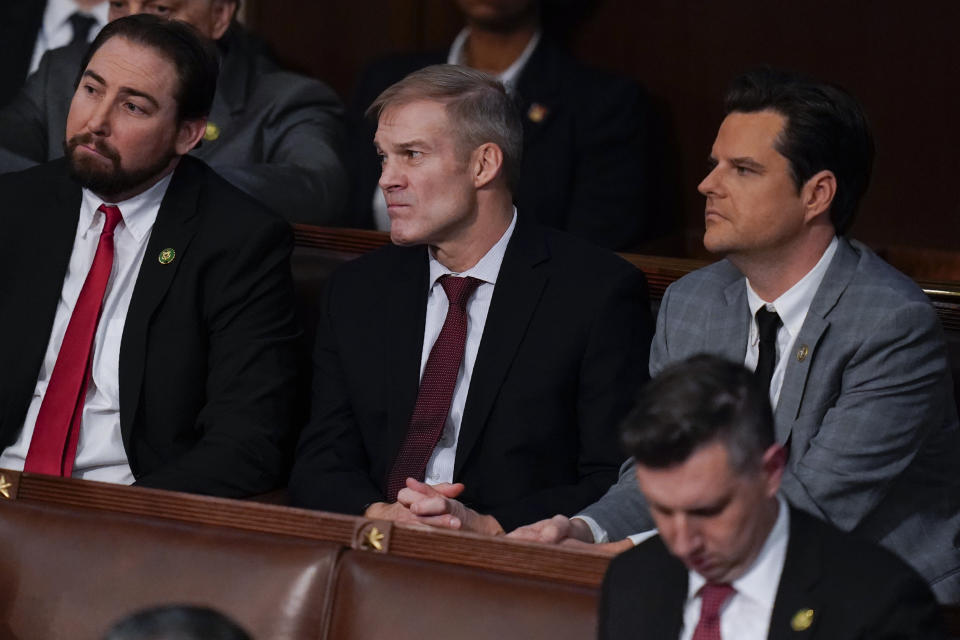 Rep. Eli Crane, R-Ariz., left, Rep. Jim Jordan, R-Ohio, and Rep. Matt Gaetz, R-Fla., listen tot he 14th vote in the House chamber as the House meets for the fourth day to elect a speaker and convene the 118th Congress in Washington, Friday, Jan. 6, 2023. (AP Photo/Alex Brandon)