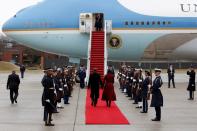 FILE PHOTO: Former president Barack Obama and his wife, Michelle, walk to board Special Air Mission 28000, a Boeing 747 which serves as Air Force One, at Joint Base Andrews, Maryland