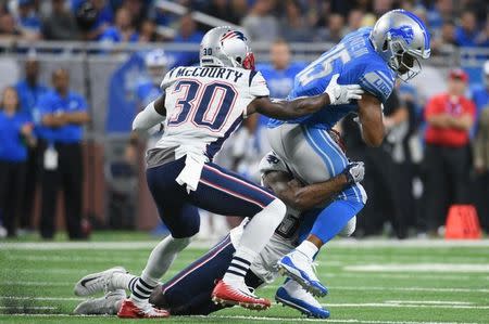 Sep 23, 2018; Detroit, MI, USA; Detroit Lions wide receiver Golden Tate (15) is tackled by New England Patriots cornerback Jason McCourty (30) during the first quarter at Ford Field. Mandatory Credit: Tim Fuller-USA TODAY Sports