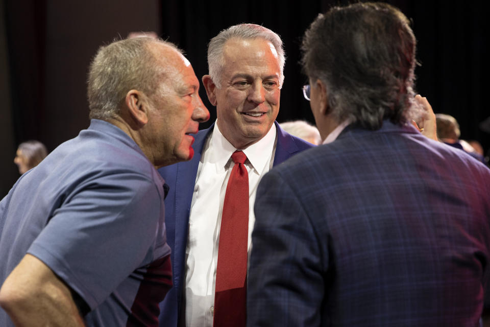 Nevada Republican gubernatorial nominee Joe Lombardo, center, speaks with attendees following a debate with Gov. Steve Sisolak, D-Nev., during IndyFest at Worre Studios, Sunday, Oct. 2, 2022, in Las Vegas. (AP Photo/Ellen Schmidt)