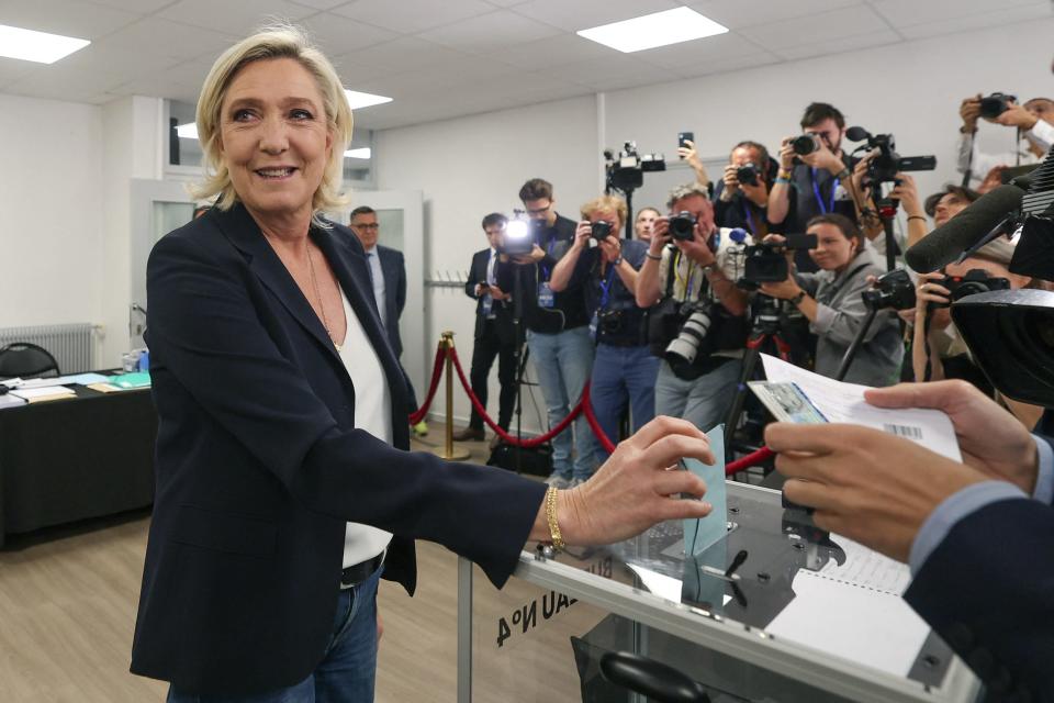 Marine Le Pen, president of the far-right French parliamentary group Rassemblement National (RN) in the National Assembly, casts her vote in the first round of parliamentary elections in Henin-Beaumont, northern France, on June 30, 2024.