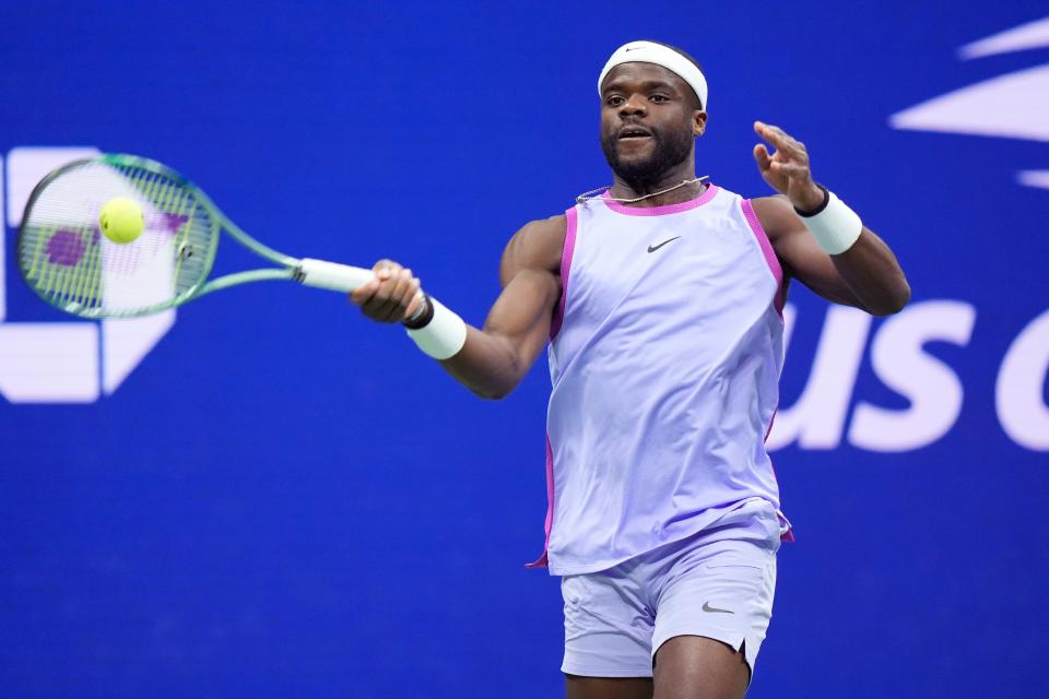 Frances Tiafoe, of the United States, returns to Grigor Dimitrov, of Bulgaria, during the quarterfinals of the U.S. Open tennis championships, Tuesday, Sept. 3, 2024, in New York (AP)