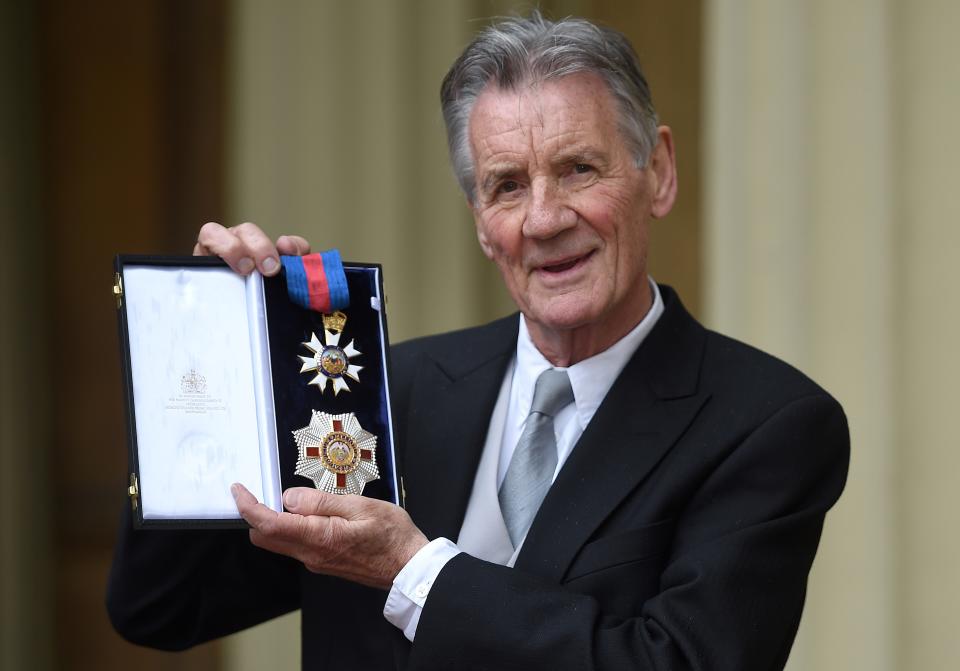 British actor and television presenter Michael Palin poses with his medals after being appointed a Knight Commander of the Order of St Michael and St George (KCMG) during an investiture ceremony at Buckingham Palace in London on June 12, 2019. (Photo by David Mirzoeff / POOL / AFP)        (Photo credit should read DAVID MIRZOEFF/AFP via Getty Images)