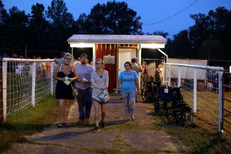 A group of people enter the Remote Area Medical Clinic in Wise, Virginia, U.S., July 22, 2017. REUTERS/Joshua Roberts