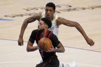 Toronto Raptors' Jalen Harris (2) sprints to the basket past Dallas Mavericks guard Josh Richardson (0) in the second half of an NBA basketball game in Dallas, Friday, May 14, 2021. (AP Photo/Tony Gutierrez)