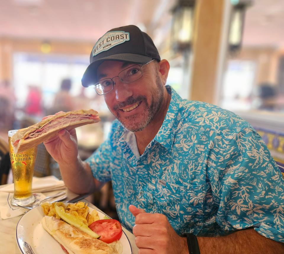 Wade Tatangelo getting ready to eat a Cuban sandwich at Columbia Restaurant on St. Armands Circle in Sarasota on July 30, 2023.