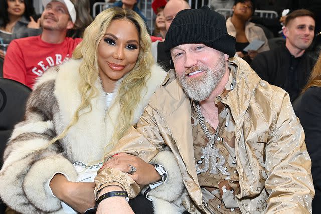 <p>Paras Griffin/Getty</p> Tamar Braxton and Jeremy "JR" Robinson attend the game between Orlando Magic and the Atlanta Hawks at State Farm Arena on January 17, 2024.