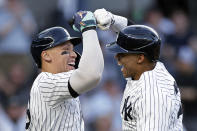 New York Yankees' Juan Soto celebrates with Aaron Judge, left, after hitting a two-run home run against the Houston Astros during the first inning of a baseball game Wednesday, May 8, 2024, in New York. (AP Photo/Adam Hunger)