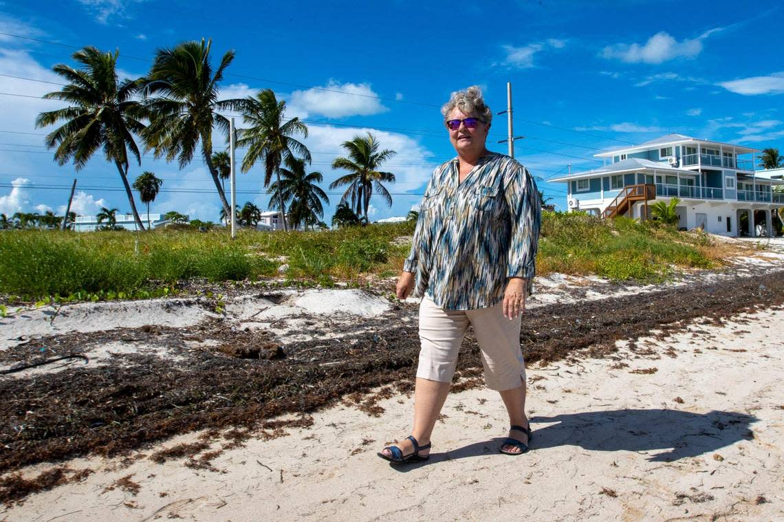 Christine Hurley, executive director for the Monroe County Land Authority, stands on a lot lot recently bought by the Community Development Block Grant-Disaster Recovery funds for the Monroe County Voluntary Home Buyout Program at Long Pine Key in Layton, Florida, on Wednesday, Aug. 24, 2022.