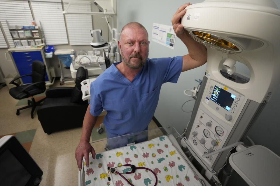 Dr. Eric Scott Palmer, a neonatologist, poses for a portrait in the special care nursery at the Henry County Medical Center in Paris, Tenn., on Tuesday, Aug. 29, 2023. Palmer said that when the facility closes its maternity and special care facility, "There will be people hurt. It's not a question of if — simply when." (AP Photo/Mark Humphrey)