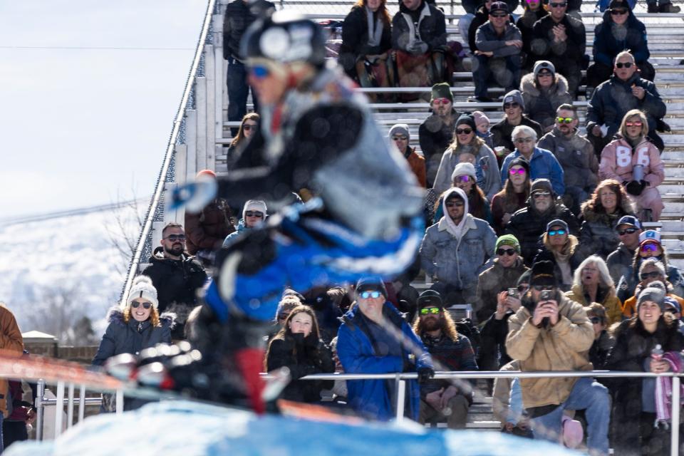 Spectators watch Bryan Coll ski off a jump during the 2024 Utah Skijoring competition at the Wasatch County Event Complex in Heber City on Saturday, Feb. 17, 2024. | Marielle Scott, Deseret News