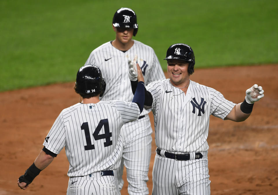 Luke Voit (right) takes over MLB home run lead as Yankees rack up 20 runs against Toronto. (Photo by Sarah Stier/Getty Images)