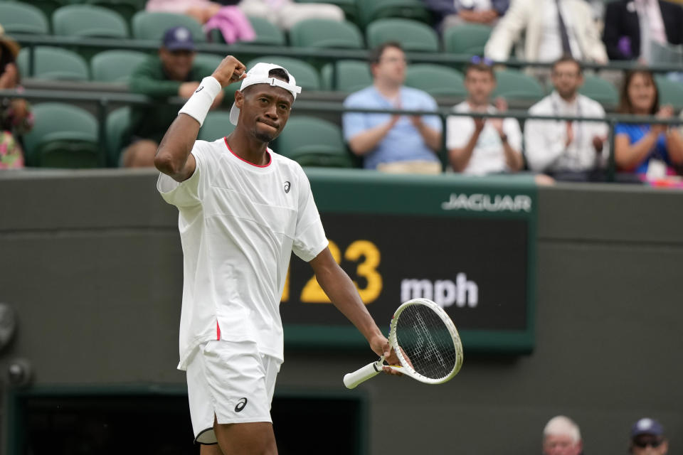 Christopher Eubanks of the US celebrates a point against Russia's Daniil Medvedev during their men's singles match on day ten of the Wimbledon tennis championships in London, Wednesday, July 12, 2023. (AP Photo/Alastair Grant)