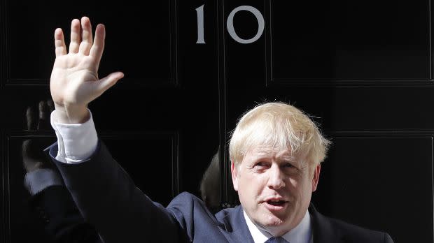 FILE - In this file photo dated Wednesday, July 24, 2019, Britain's Prime Minister Boris Johnson waves from the steps outside 10 Downing Street in London. In a letter released Wednesday Aug. 28, 2019, Prime Minister Johnson has written to fellow lawmakers explaining his decision to ask Queen Elizabeth II to suspend Parliament as part of the government plans before the Brexit split from Europe.