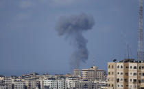 Smoke rises following Israeli airstrikes on a building in Gaza City, Saturday, Aug. 6, 2022. (AP Photo/Hatem Moussa)