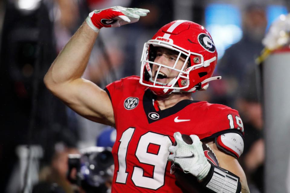 Georgia tight end Brock Bowers (19) celebrates after scoring a touchdown during the second half of a NCAA college football game against Ole Miss in Athens, Ga., on Saturday, Nov. 11, 2023. Georgia won 52-17.