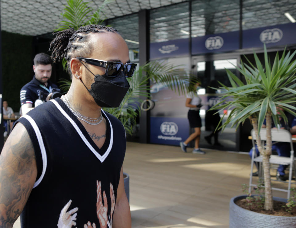 Mercedes driver Lewis Hamilton of Britain arrives at the Formula One corniche circuit, in Jiddah, Saudi Arabia, Thursday, Dec. 2, 2021. The F1 race, which will take place from Dec. 3-5, will be the first time Saudi Arabia hosts the premier sporting event. (AP Photo/Amr Nabil)