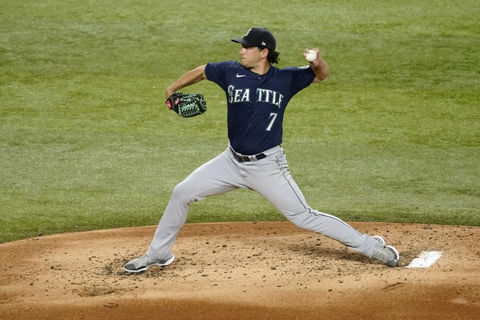 Seattle Mariners starting pitcher Marco Gonzales throws to a Texas Rangers batter during the second inning of a baseball game Thursday, July 14, 2022, in Arlington, Texas. (AP Photo/Tony Gutierrez)