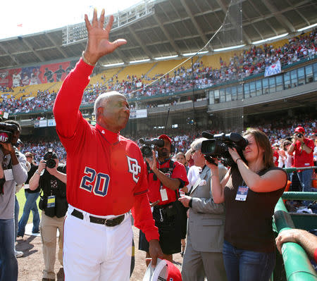 FILE PHOTO: Washington Nationals Manager Frank Robinson waves to the fans on his last day as the Nationals manager in Washington October 1, 2006. REUTERS/Joshua Roberts/File Photo