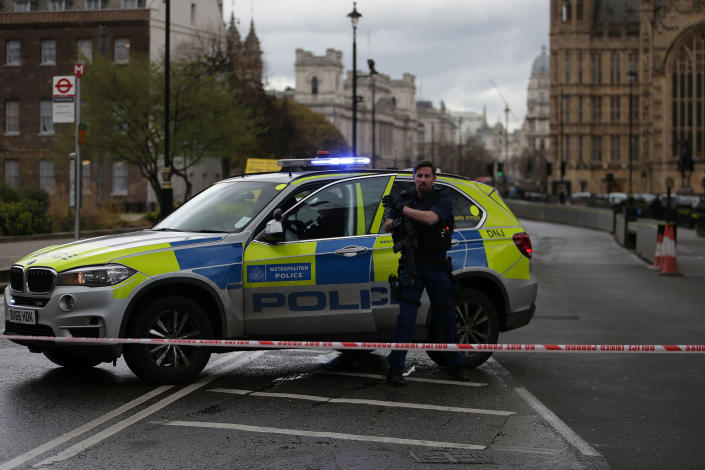 <p>An armed police officer gets out of a car inside a police cordon outside the Houses of Parliament in central London on March 22, 2017 during an emergency incident. (Daniel Leal-Olivas /AFP/Getty Images) </p>