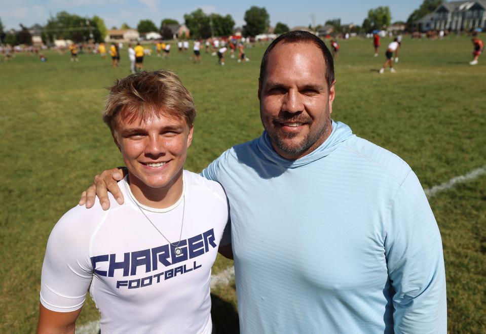 Isaac Wilson and his dad Mike Wilson pose for a photo during a break of a 7-on-7 passing league game in Layton on Friday, June 9, 2023. | Scott G Winterton, Deseret News