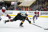 Vegas Golden Knights center Chandler Stephenson (20) battles against Montreal Canadiens defenseman Shea Weber (6) during the second period in Game 5 of an NHL hockey Stanley Cup semifinal playoff series Tuesday, June 22, 2021, in Las Vegas. (AP Photo/John Locher)