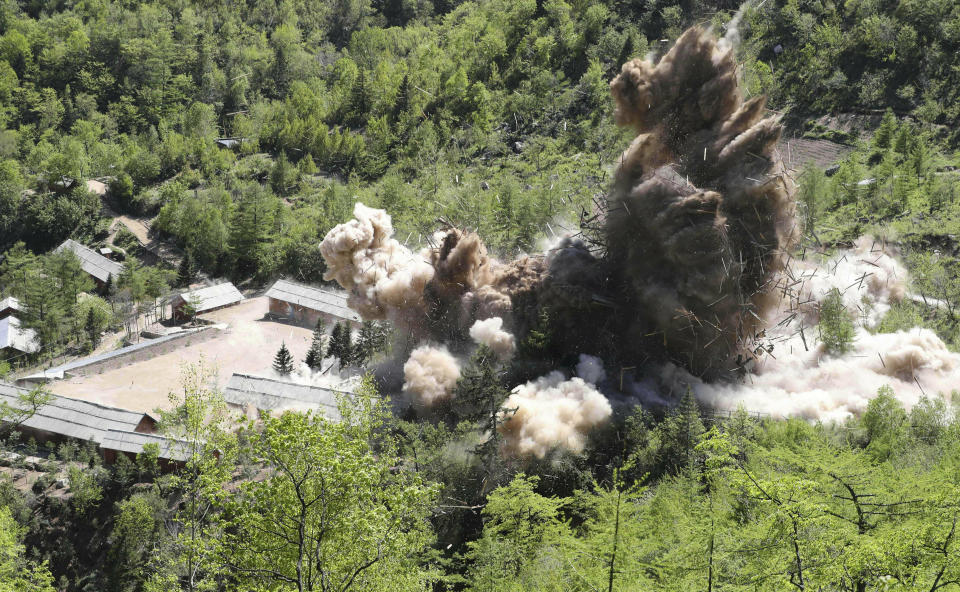 FILE - In this May 24, 2018, file photo, command post facilities of North Korea's nuclear test site are exploded in Punggye-ri, North Korea. The Hanoi summit with U.S. President Donald Trump is, in many ways, a test of what the North Korean leader Kim Jong Un will be willing to accept for sacrificing this ultimate security guarantee. (Korea Pool/Yonhap via AP, File)