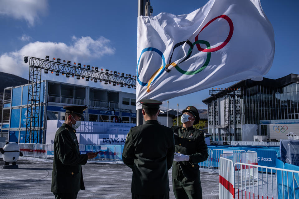 ZHANGJIAKOU, CHINA - JANUARY 25: Peoples Liberation Army soldiers rehearse a flag raising drill at the medal plaza in Zhangjiakou Olympic village on January 25, 2022 in Zhangjiakou, China. With just over one week to go until the opening ceremony of the Beijing 2022 Winter Olympics, final preparations are being made in Beijing ahead of the forthcoming 2022 Winter Olympics. (Photo by Carl Court/Getty Images)