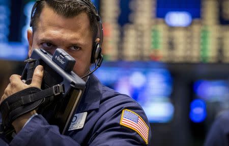 A trader works on the floor of the New York Stock Exchange August 15, 2014. REUTERS/Brendan McDermid