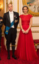 <p>The Duchess recycled yet another dress, wearing a royal red Jenny Packham gown to the 2016 annual Diplomatic Reception. First seen on her at a state banquet in 2015, the design’s scarlet shade was intended to celebrate China and features Kate’s favourite slim-fitting waist style. She also wore the extremely heavy Cambridge Lover’s Knot tiara - which once belonged to Diana - along with chandelier earrings and a diamond bracelet given to her by William.</p><p><i>[Photo: PA]</i></p>