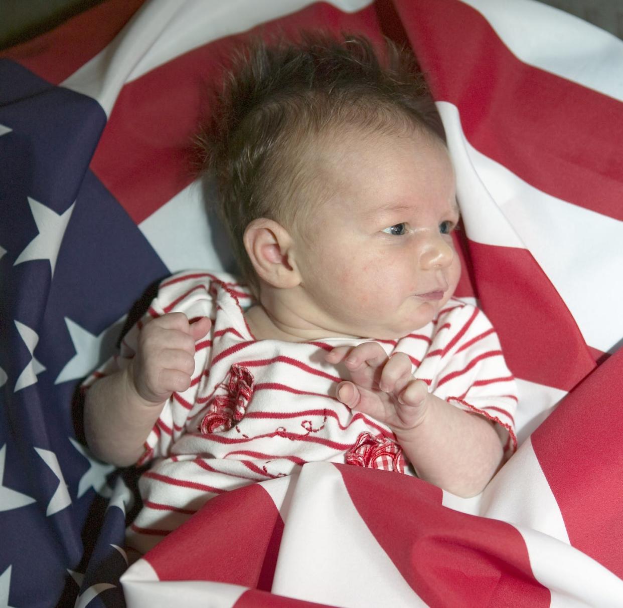 <span class="caption">Some people are U.S. citizens at birth, like this baby born in California.</span> <span class="attribution"><a class="link " href="https://www.shutterstock.com/image-photo/newborn-baby-sophia-larson-wrapped-american-266006306" rel="nofollow noopener" target="_blank" data-ylk="slk:Joseph Sohm/Shutterstock.com;elm:context_link;itc:0;sec:content-canvas">Joseph Sohm/Shutterstock.com</a></span>