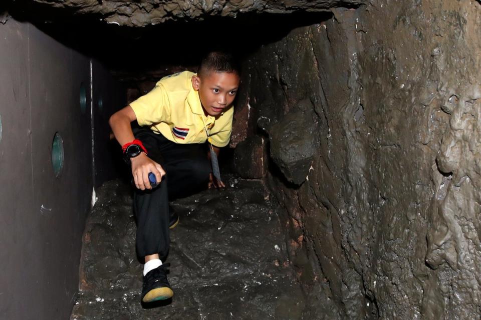 Mongkol Boonpiam, a rescued member of Wild Boar football team, inside the mock cave (EPA)