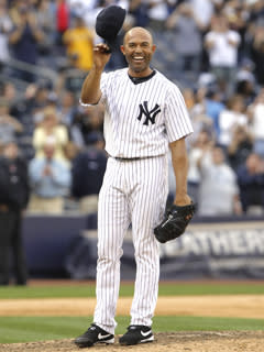 New York closer Mariano Rivera tips his hats to fans at Yankee Stadium after becoming baseball's all-time saves leader on Monday
