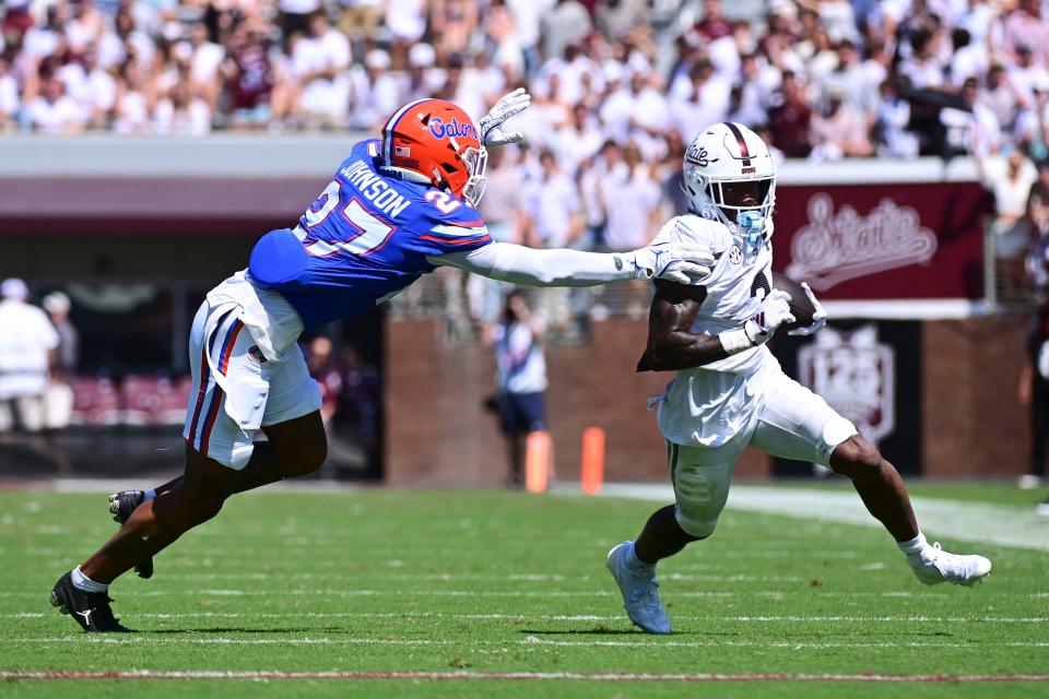 Mississippi State receiver Kevin Coleman Jr. runs past Florida defensive back Dijon Johnson during the Bulldogs' loss Saturday.