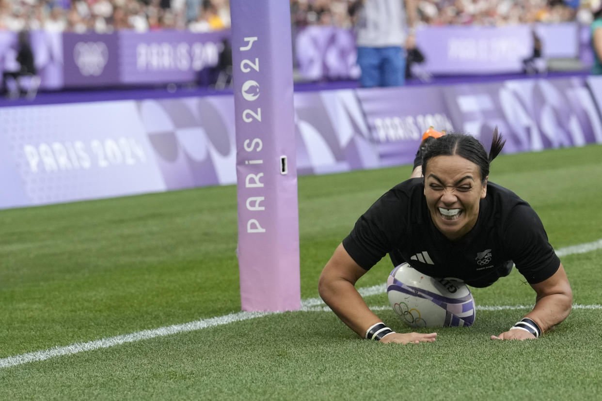 New Zealand's Stacey Waaka dives over the line to score a try during the women's gold medal Rugby Sevens match between New Zealand and Canada at the 2024 Summer Olympics, in the Stade de France, in Saint-Denis, France on July 30, 2024. (Vadim Ghirda/AP)