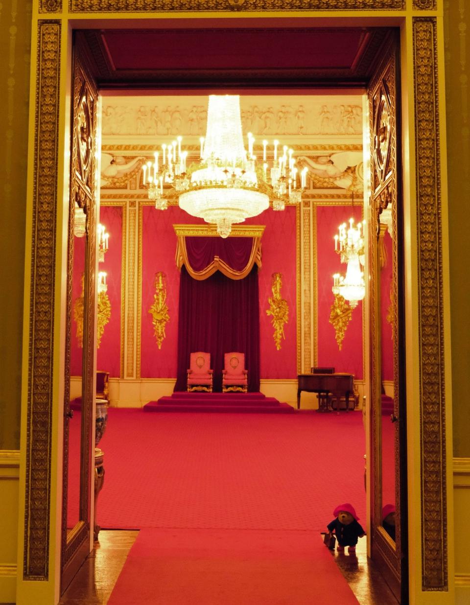 Paddington Bear explores the throne room at Buckingham Palace - Buckingham Palace/PA