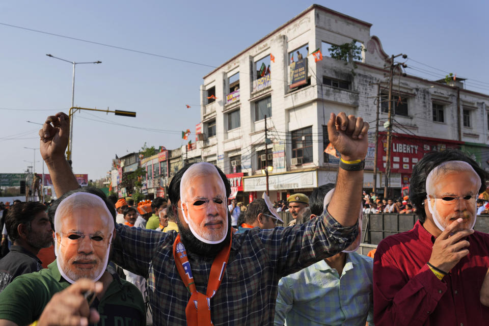 Supporters of Bharatiya Janata Party (BJP) wear Indian prime Minister Narendra Modi masks during an election campaign in Ghaziabad, India, April 6, 2024. India is in election mode with colorful, and frenzied, campaign underway by various political parties to woo voters across the country. From April 19 to June 1, nearly 970 million Indians or over 10% of the global population are eligible to vote in India's general election. (AP Photo/ Manish Swarup)