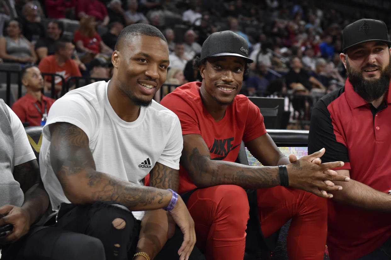 Damian Lillard and DeMar DeRozan watched the Las Vegas Aces take on the Connecticut Sun on Saturday. (Photo by David Becker/NBAE via Getty Images)