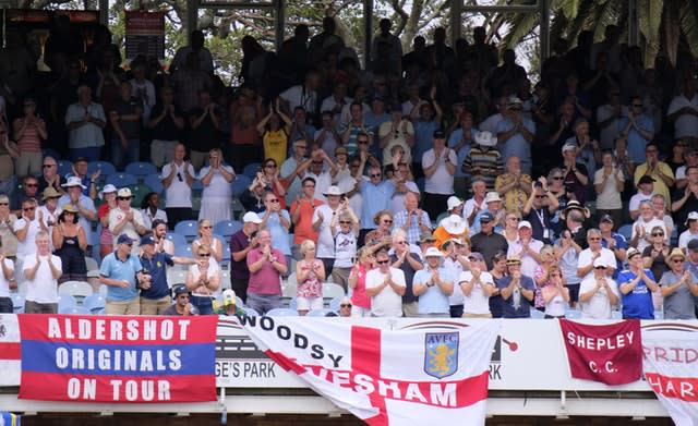 England fans perform a standing ovation for Pope as he makes his hundred 