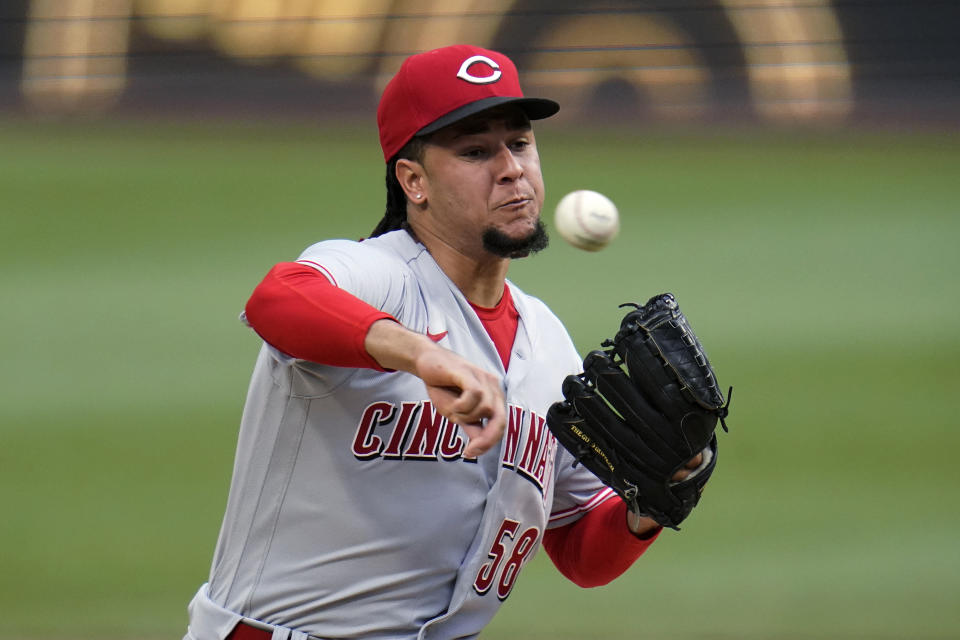 Cincinnati Reds starting pitcher Luis Castillo delivers during the first inning of the team's baseball game against the Pittsburgh Pirates in Pittsburgh, Saturday, May 14, 2022. (AP Photo/Gene J. Puskar)