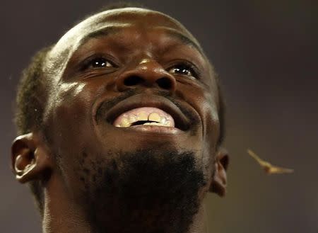 Usain Bolt of Jamaica celebrates after winning the men's 4 x 100 metres relay final during the 15th IAAF World Championships at the National Stadium in Beijing, China August 29, 2015. REUTERS/Dylan Martinez