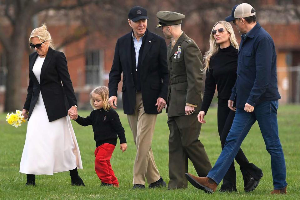 <p>Mike Theiler/AFP/Getty</p> Joe and Jill Biden walk with family, including grandson Beau, while arriving at Fort McNair in Washington, D.C. on March 31, 2024