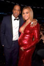 <p>The loved-up couple in an embrace moments after Bey’s wardrobe change. Firetruck red sparkles? We’re looking this look! <i>(Getty). </i></p>