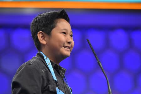 May 31, 2017; National Harbor, MD, USA; 5th grader Jaden Zhang from Ontario spelled the word pahoehoe (cooled hard lava) correctly during the 2017 Scripps National Spelling Bee at the Gaylord National Resort and Convention Center. Mandatory Credit: Jack Gruber-USA TODAY NETWORK