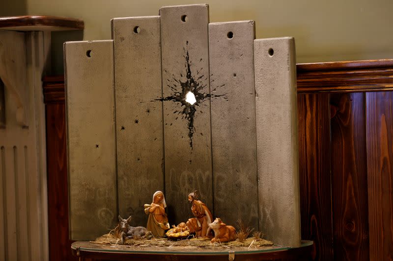 Artwork dubbed "scar of Bethlehem" by street artist Banksy is displayed in the Walled Off hotel, in Bethlehem in the Israeli-occupied West Bank