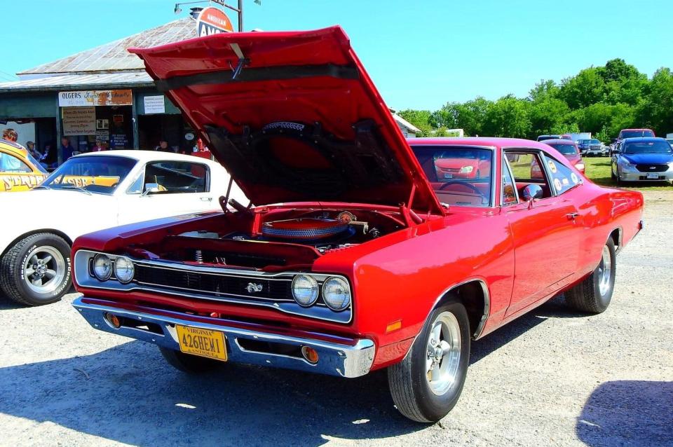 A 1969 Dodge Super Bee Coupe, one of 38 produced with a 426 Hemi engine and four-speed transmission, parked in front of Olgers Store Museum in Sutherland in May 2023. The Super Track Pack car with Dana 60 axle with 4:10 gear was the most rare vehicle at the Old School Hot Rodders of Virginia Spring Cruise In.