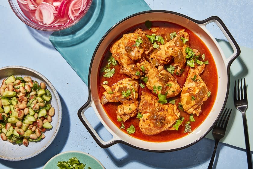 LOS ANGELES, CALIFORNIA, JULY 28, 2021: Braised Chicken with Tomatillo and a side of Bean and Cucumber Salad; for the August Week of Meals story by Ben Mims, photographed on Wednesday, July 28, 2021, at Proplink Studios in Arts District Los Angeles. (Silvia Razgova / For The Times) ATTN: 815461-la-fo-week-of-meals-august-2021