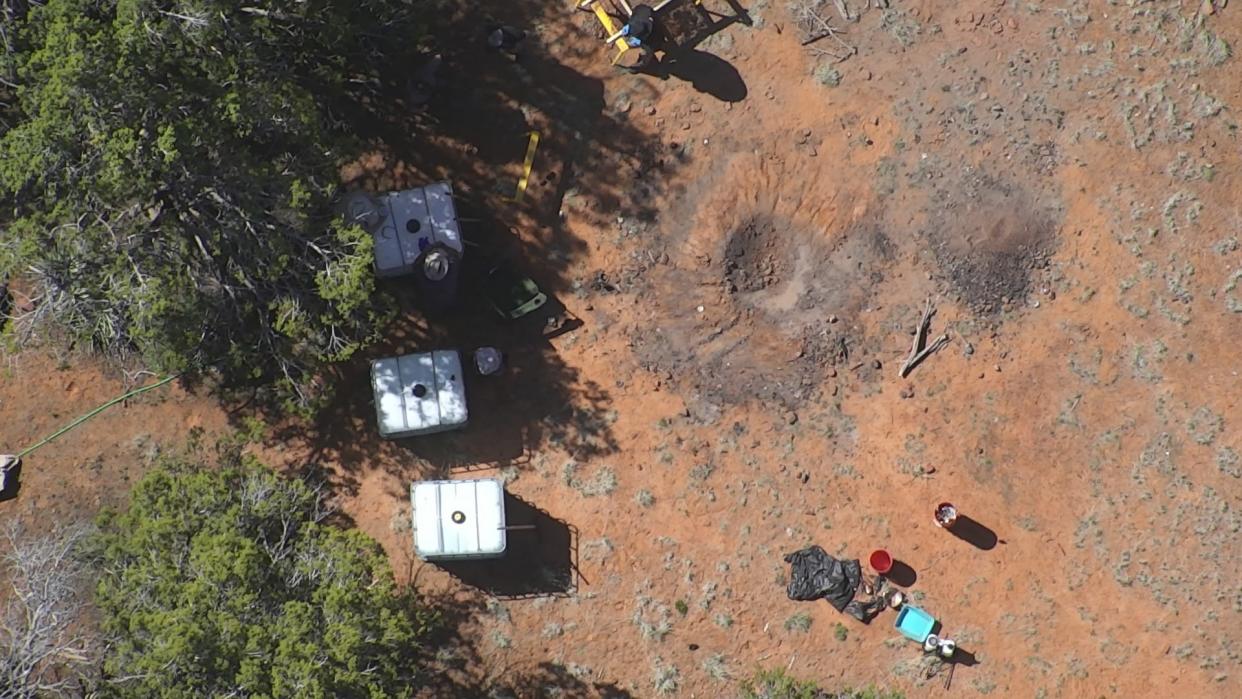 What appears to be a fire pit is seen in this aerial photo connected to an investigation in Juniper Woods in Yavapai County involving an unaccounted for homeowner and a man who authorities say admitted to breaking into the property.