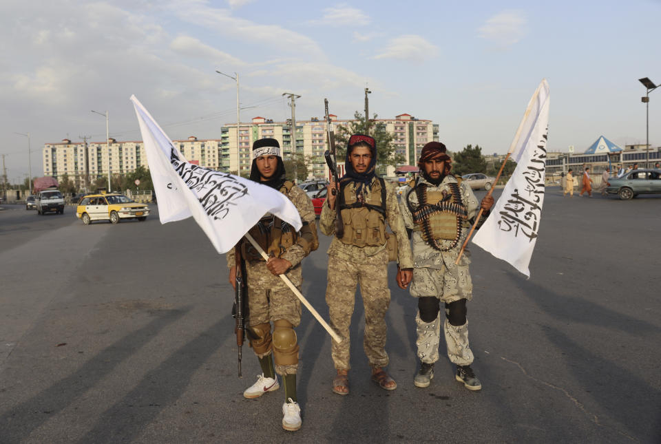 Taliban fighters hold Taliban flags in Kabul, Afghanistan, Monday, Aug. 30, 2021. Source: AP Photo/Khwaja Tawfiq Sediqi