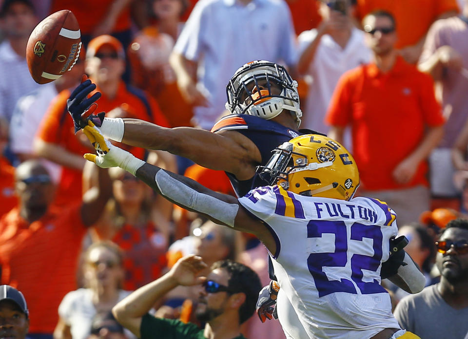 LSU cornerback Kristian Fulton (22) breaks up a pass in the end zone intended for Auburn wide receiver Darius Slayton (81) during the first half of an NCAA college football game, Saturday, Sept. 15, 2018, in Auburn, Ala. (AP Photo/Butch Dill)